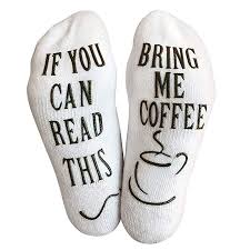 a pair of socks with the writing if you can read this, bring me coffee